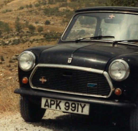 A vintage black car with license plate 